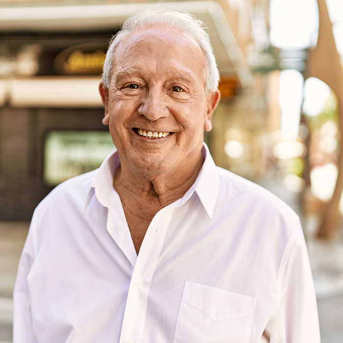 Smiling senior in a white collared shirt