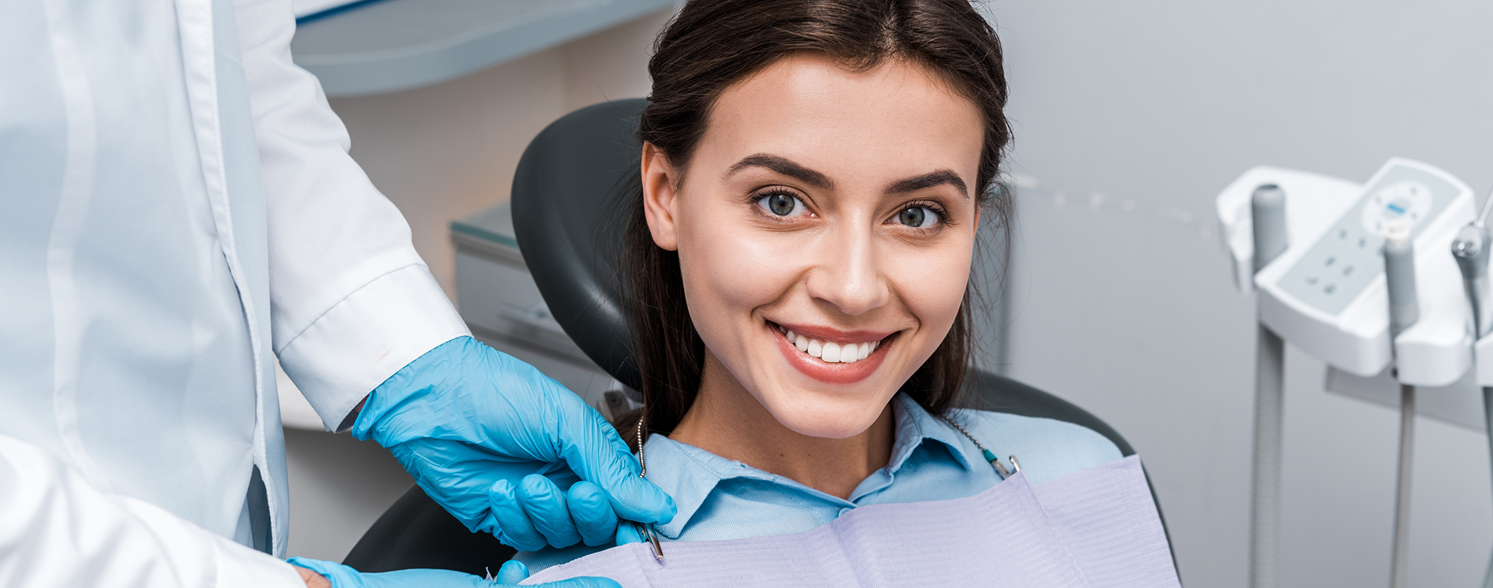 Smiling brunette woman in the dental chair