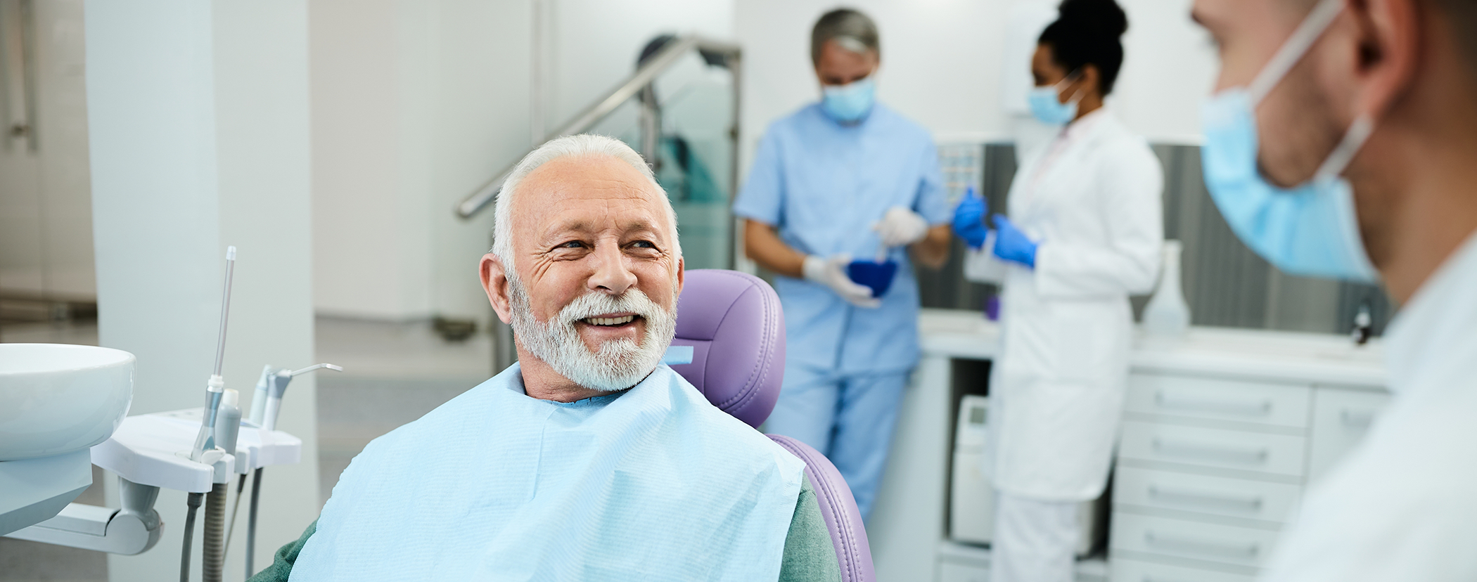 Senior man in the dental chair after replacing missing teeth in Sterling Heights