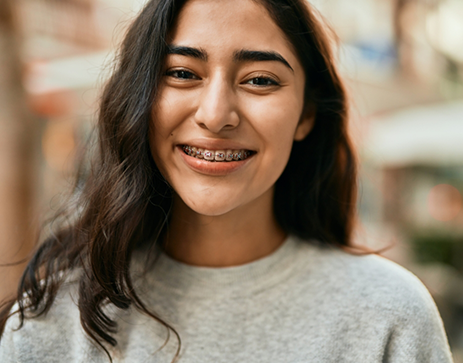 Smiling teenage girl with braces