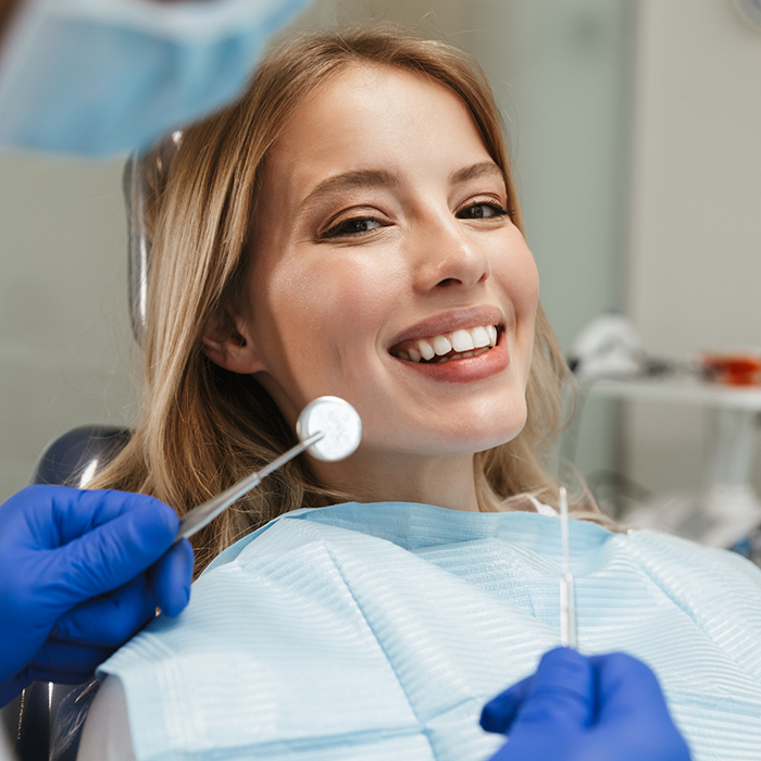 Woman smiling during a dental checkup