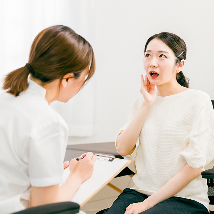 Woman talking to her dentist